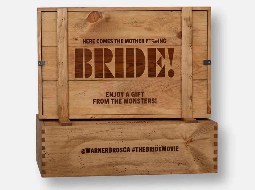 Pine crate with inset lid. Distressed detail and hand-rubbed antique pine oil finish. Pewter metal twists. Wood imprint branding in multiple locations. Box joint construction.