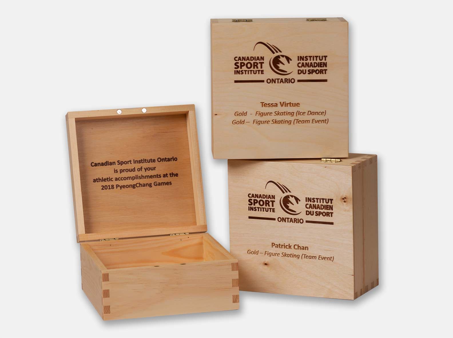 Hinged wooden presentation cases, made for the Canadian Sport Institute's athlete awards.