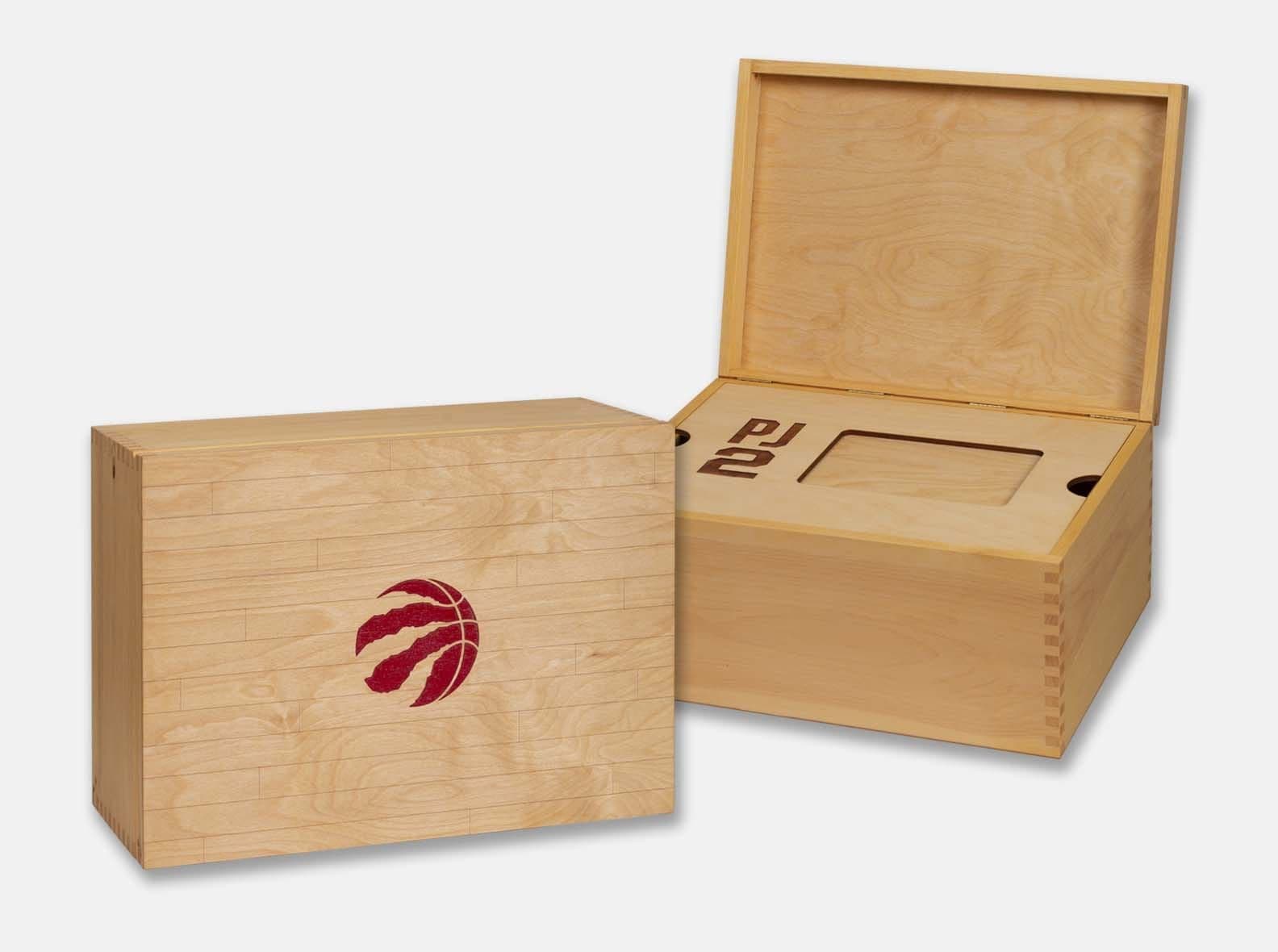 Wooden presentation box with a lid laser engraved to resemble a basketball court.