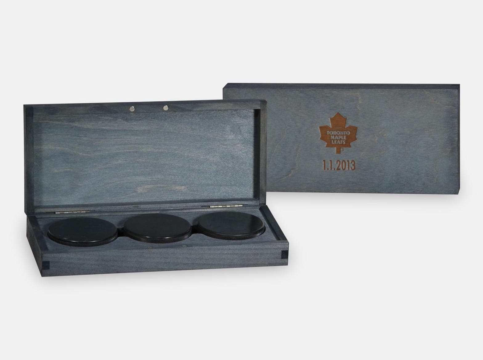 Hinged wooden puck presentation box with a magnetic closure, made for the Toronto Maple Leafs.