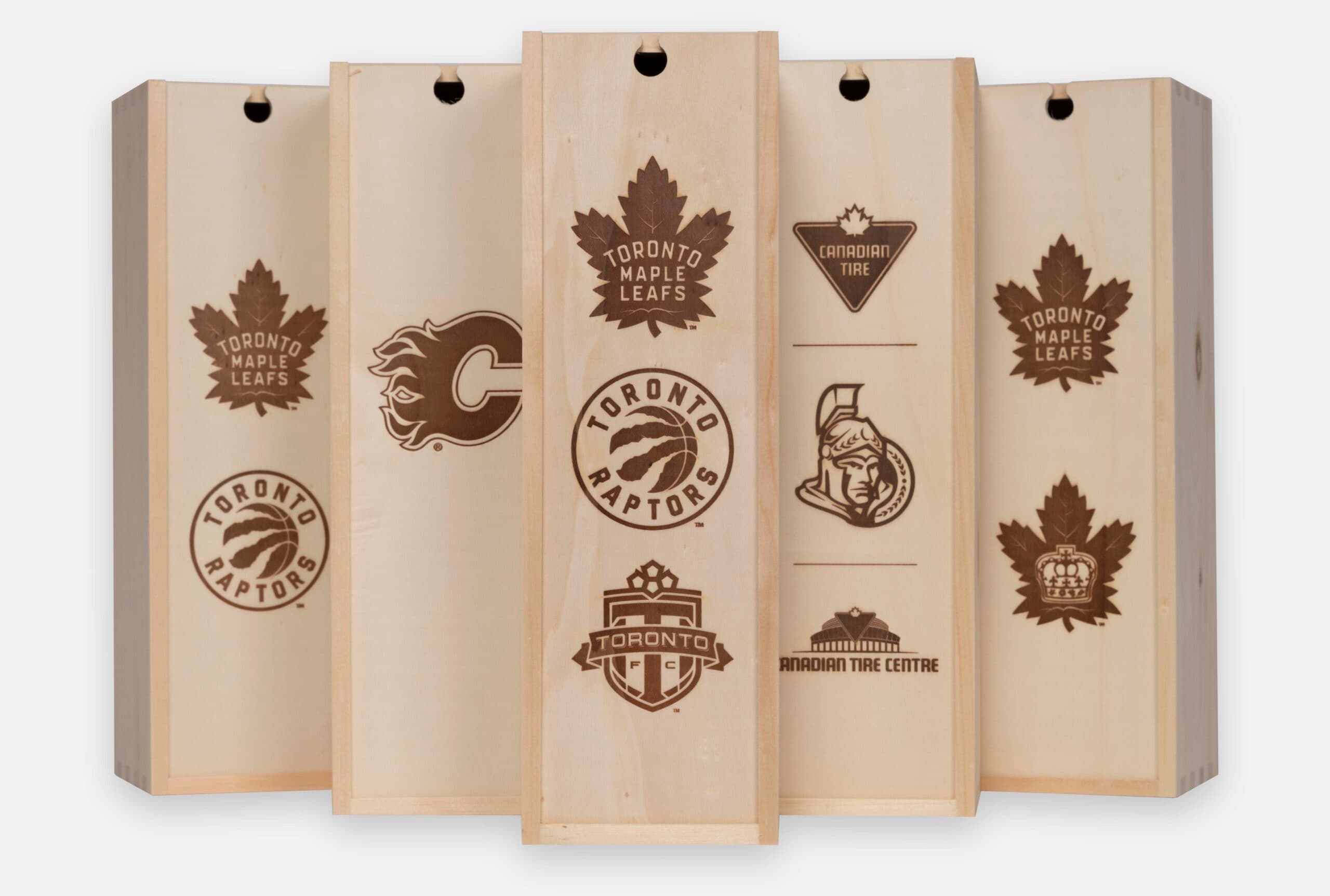 Wooden wine box with a sliding lid, engraved for MLSE corporate promotion.