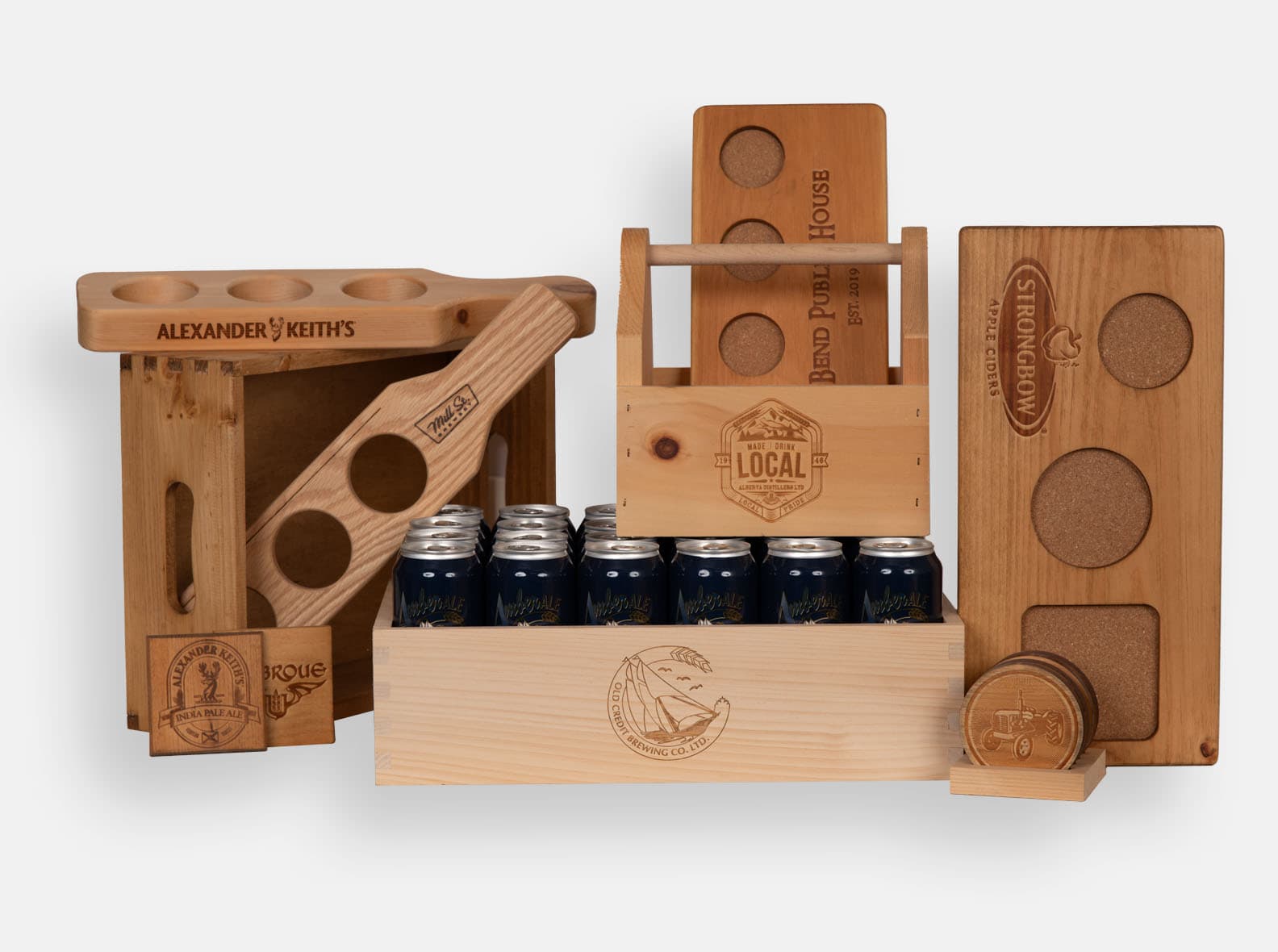 Wooden beer flights, condiment tote, and coasters with cork inlay and logo engraving.