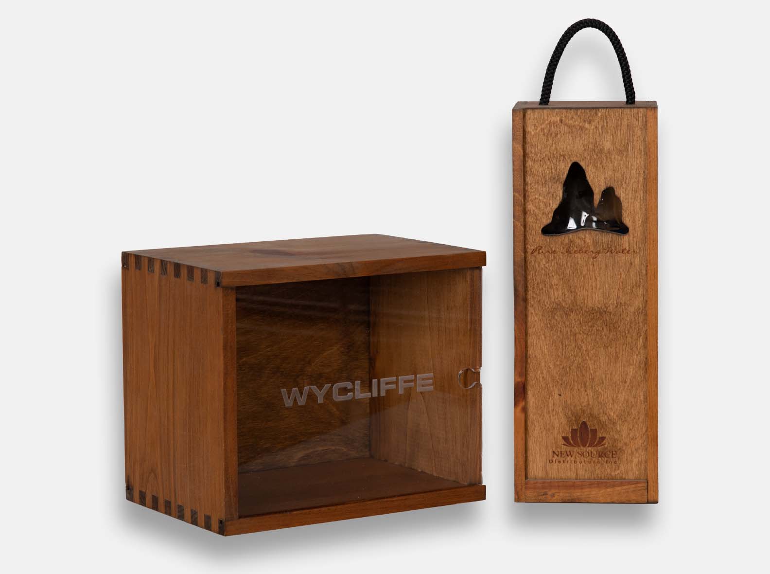 Wooden gift boxes with laser-engraved acrylic lids or CNC-cut wood lids.