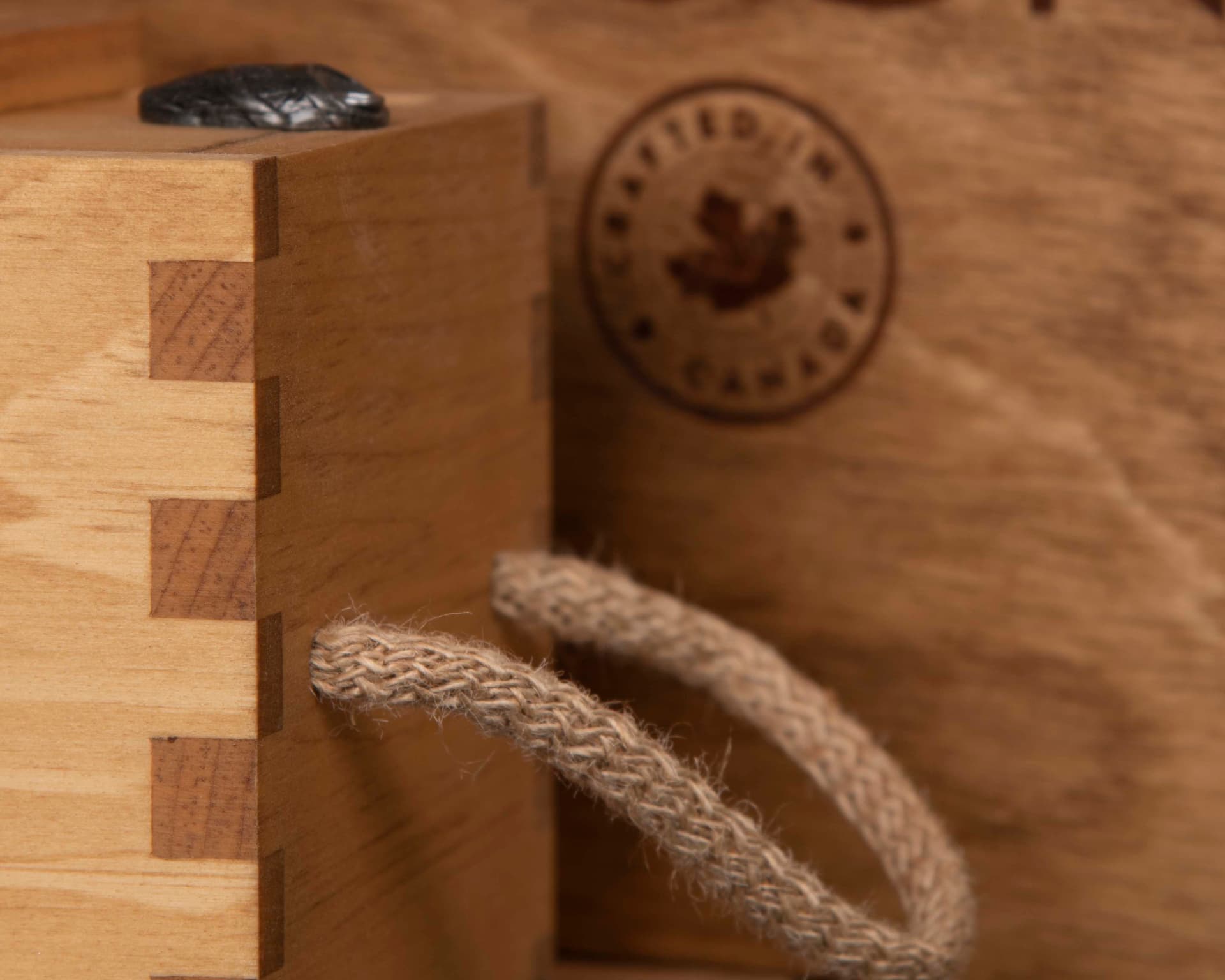 close up of box joint with jute rope handle