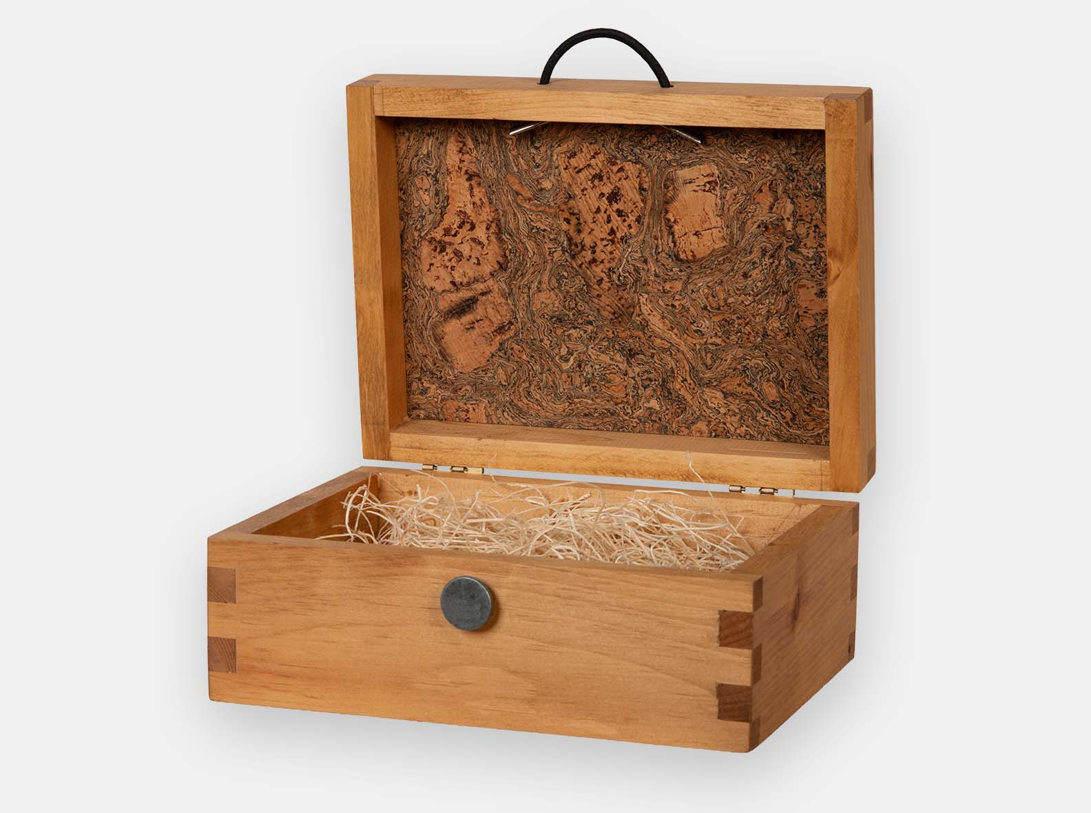 Hinged wood box with cork inlay in lid.