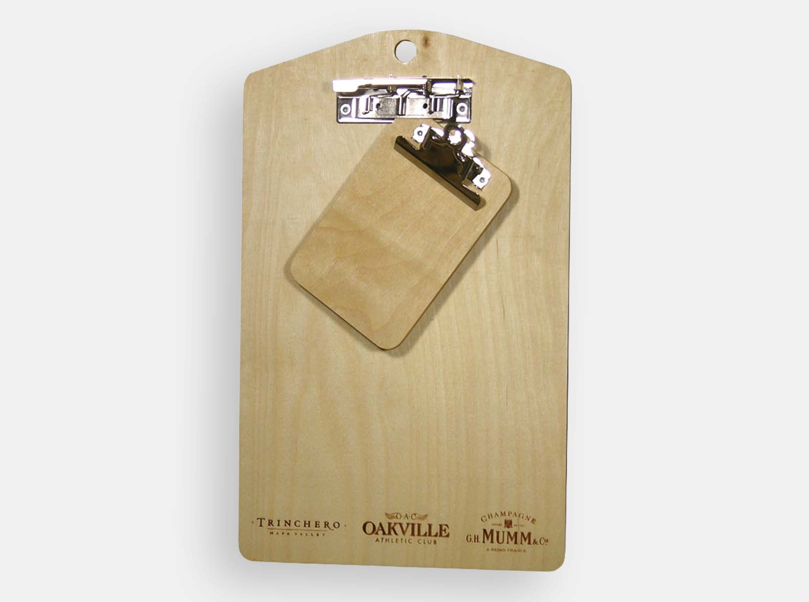 CNC cut clip boards with wood imprint branding. Natural oil finish.