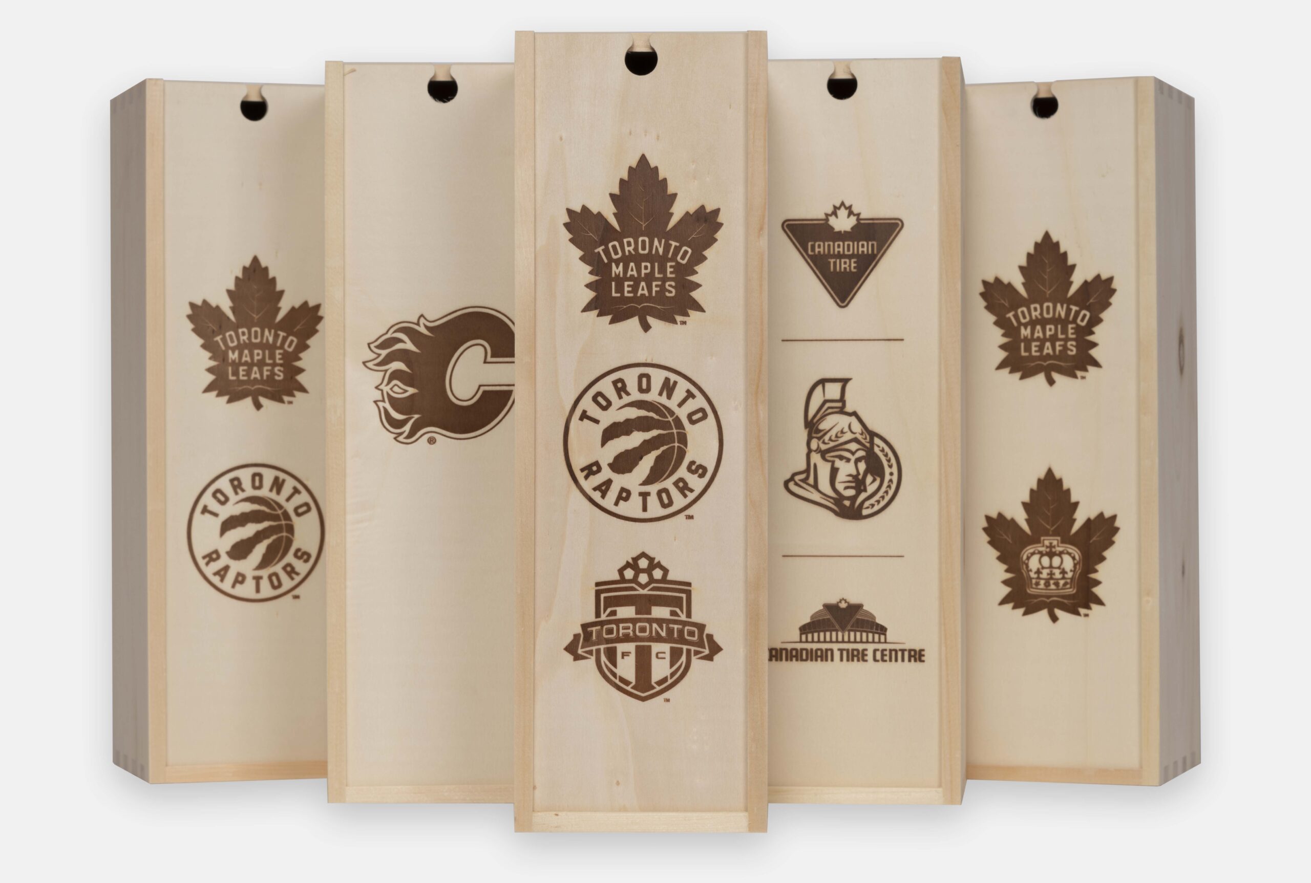 Wooden wine box with a sliding lid, engraved for MLSE corporate promotion.