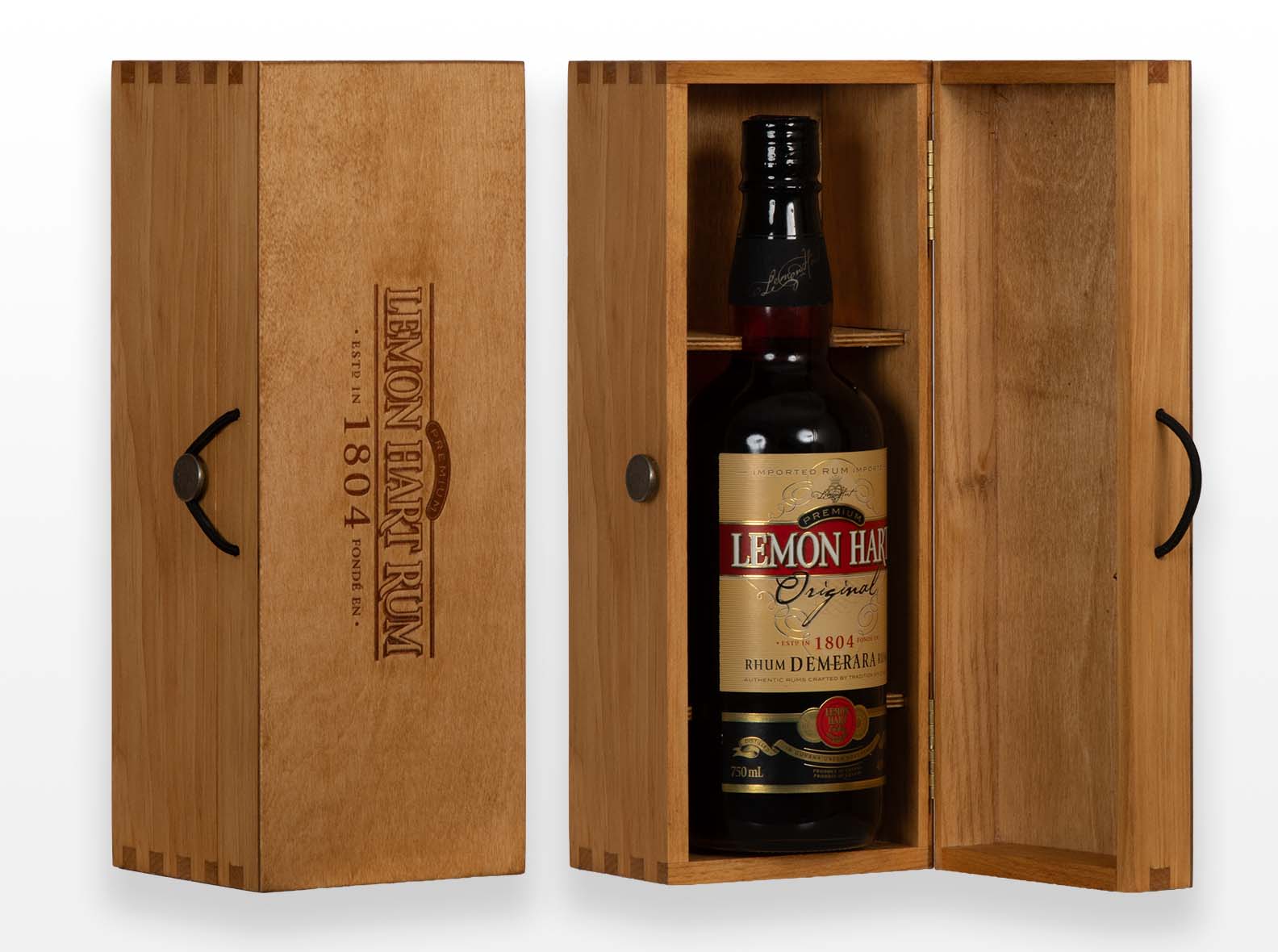 Pine hinged gift box for spirits. Custom button closure and yoke. Branding on lid. Antique pine oil finish. Box joint construction. Made by Quintessential Canada Inc.
